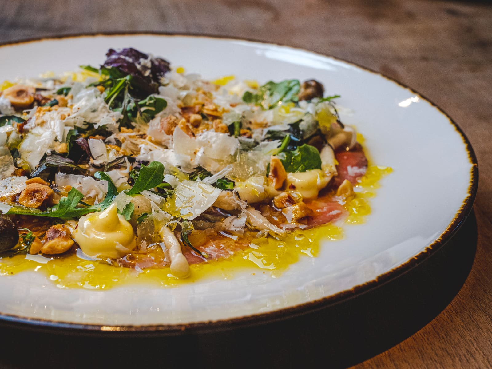 Fresh mushroom pasta with shaved cheese at Notte Ristorante