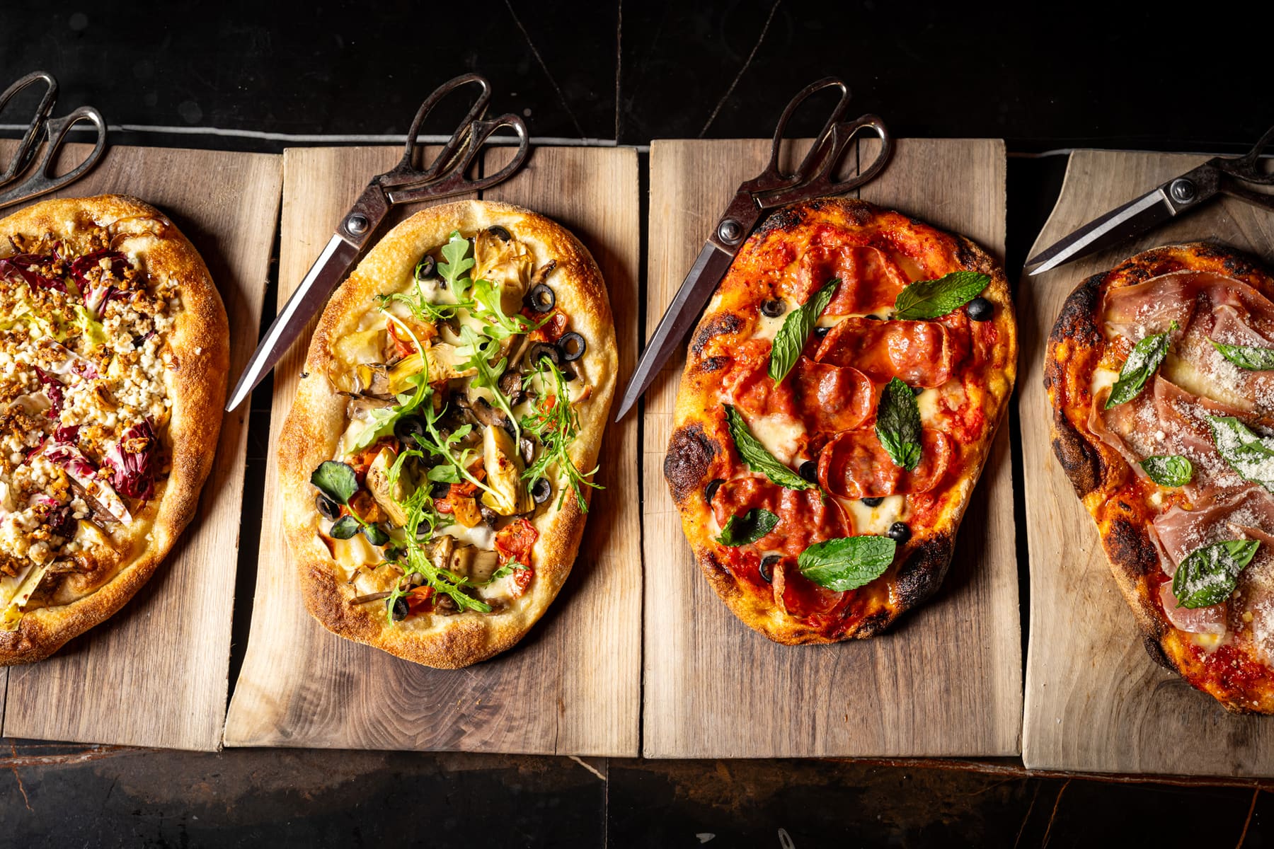 Three Roman-style pizzas from above